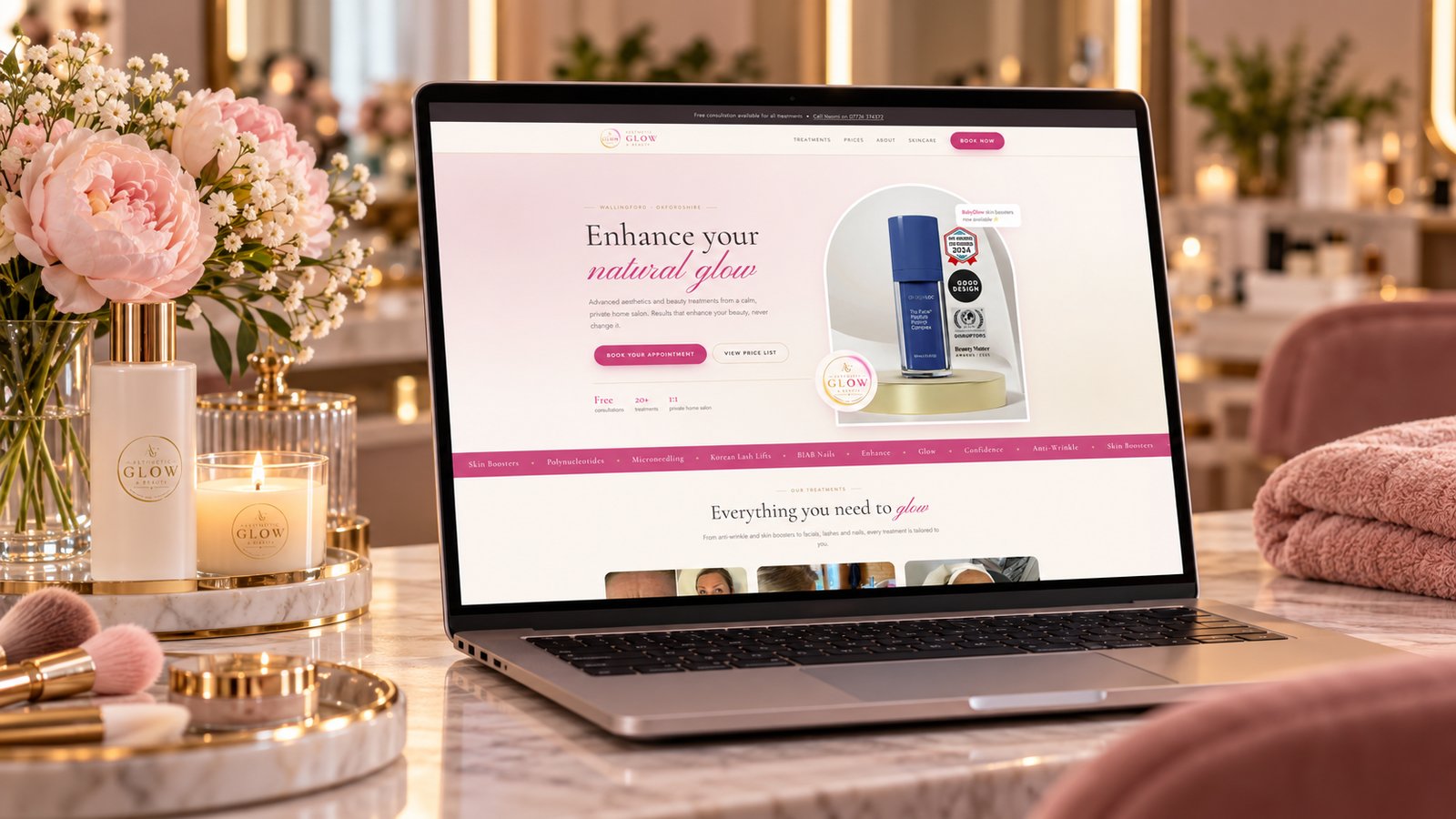 The Aesthetic Glow & Beauty website shown on a laptop in a salon