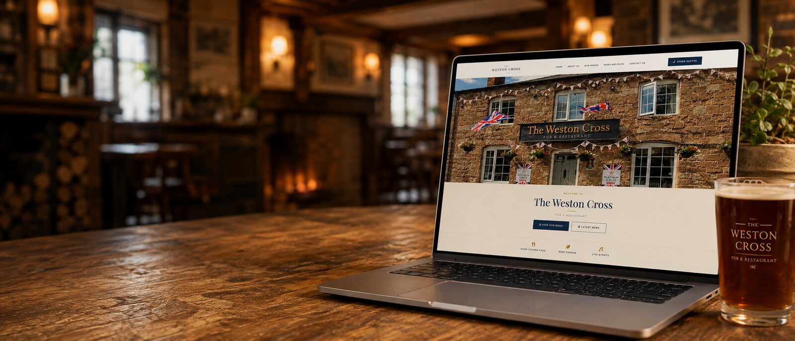 The Weston Cross website shown on a laptop in the pub